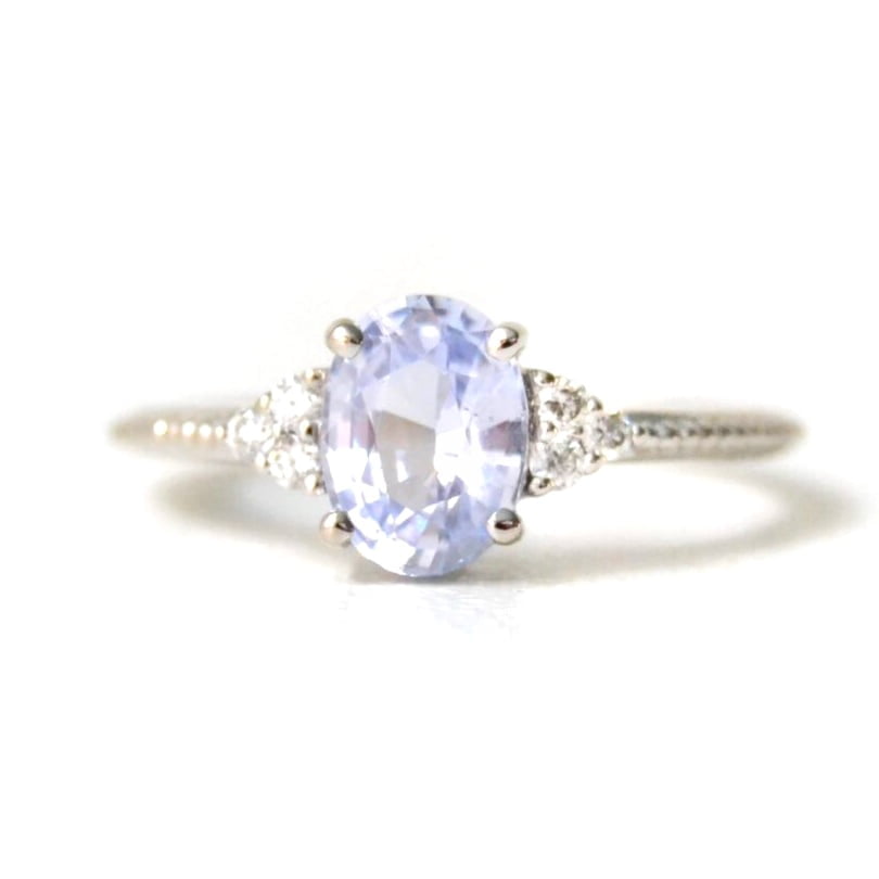 Blue sapphire ring with diamonds set in 18k white gold