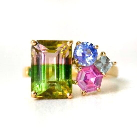 Bi-color tourmaline ring with sapphires set in 18k yellow gold
