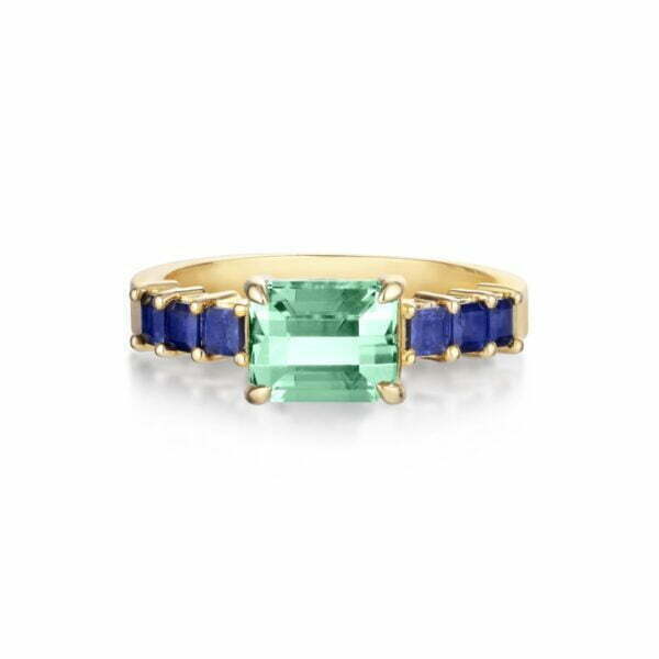East west ring with green tourmaline and blue sapphires set in 18K yellow gold