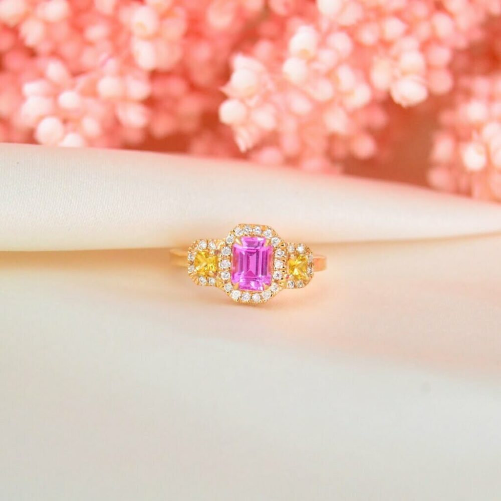 Three stone ring with emerald cut pink pink sapphire