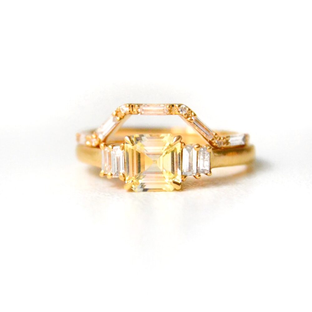 Yellow sapphire ring stacked with a diamond baguette ring in 18K yellow gold