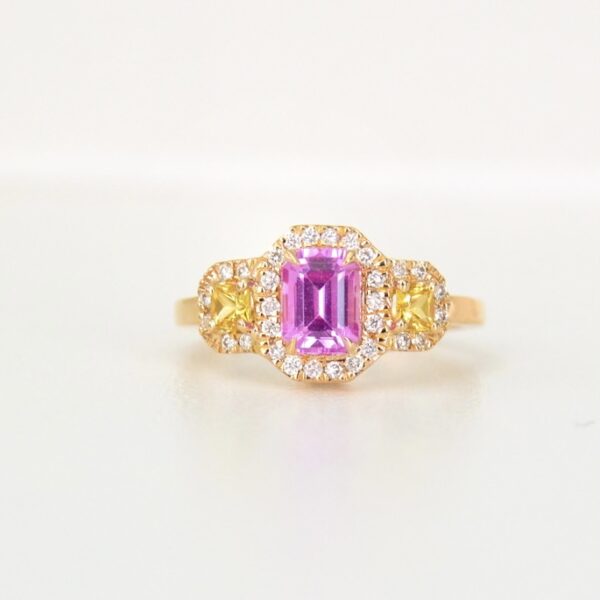 Emerald cut pink sapphire ring with yellow sapphires and diamonds
