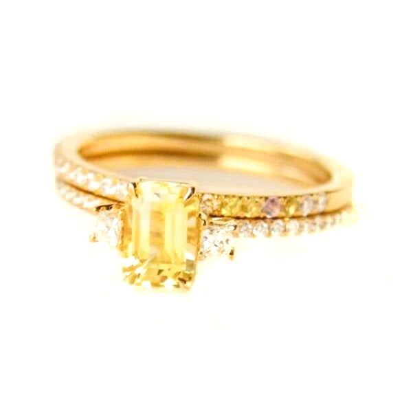 Yellow sapphire three stone ring with diamonds