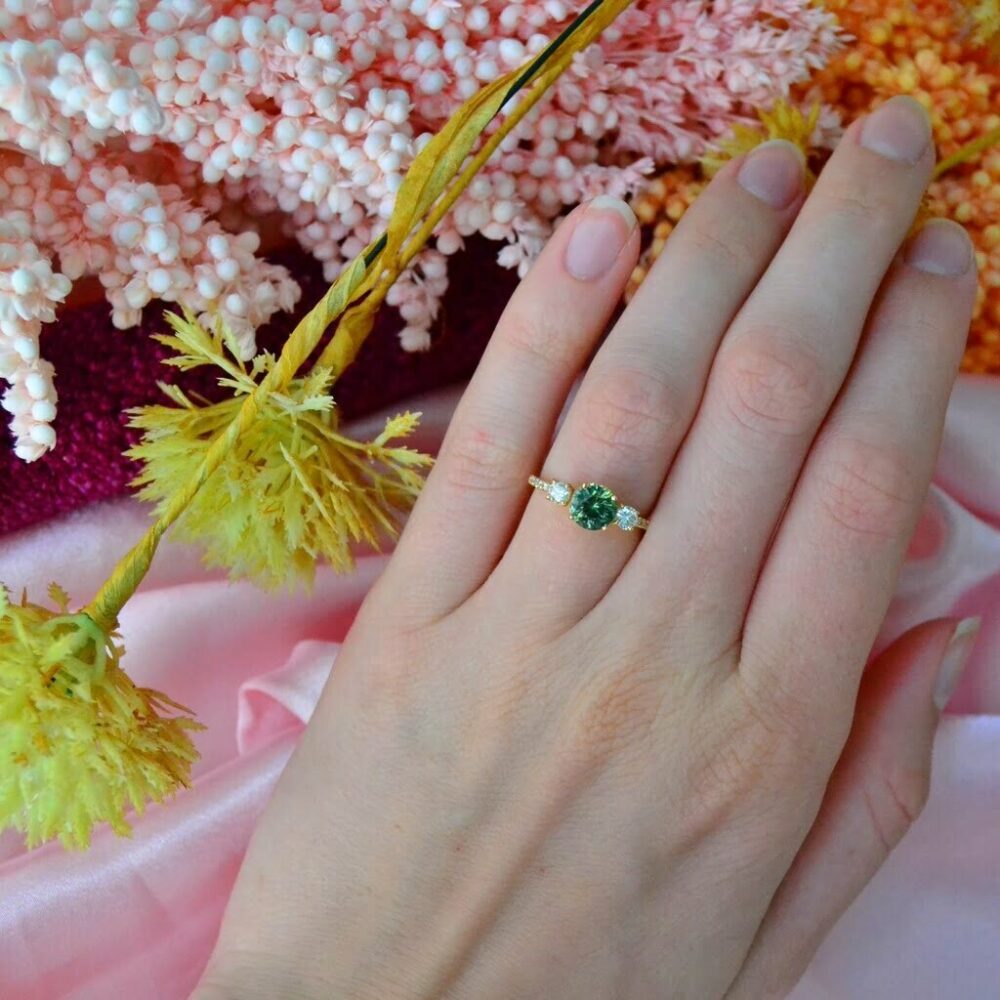 Bi-color sapphire three stone ring with diamonds