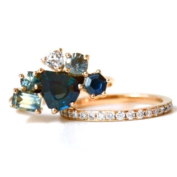 Teal sapphire ring stack with diamonds
