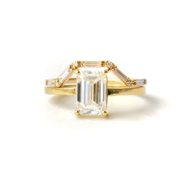 Emerald cut engagement ring stack with diamonds set in 18K yellow gold