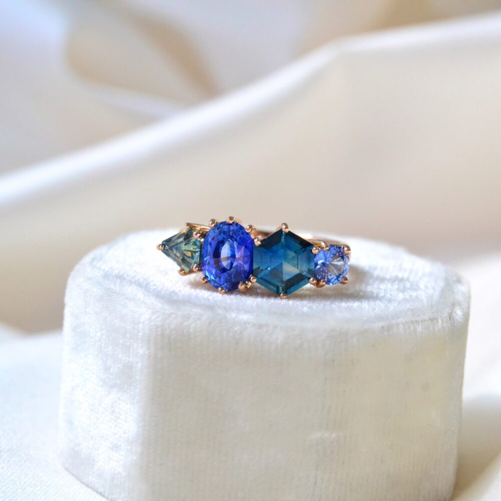 Cluster ring with blue and teal sapphires