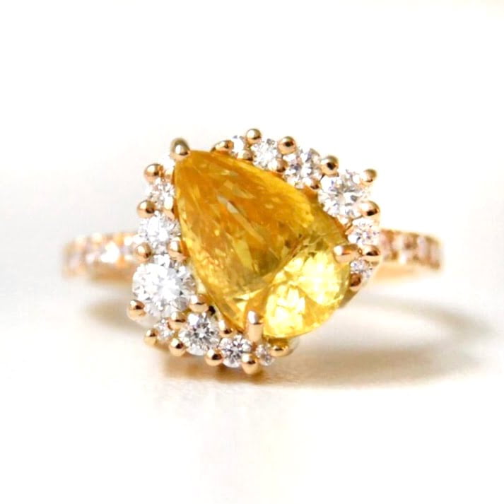 Yellow sapphire engagement ring with diamonds set in 18k yellow gold