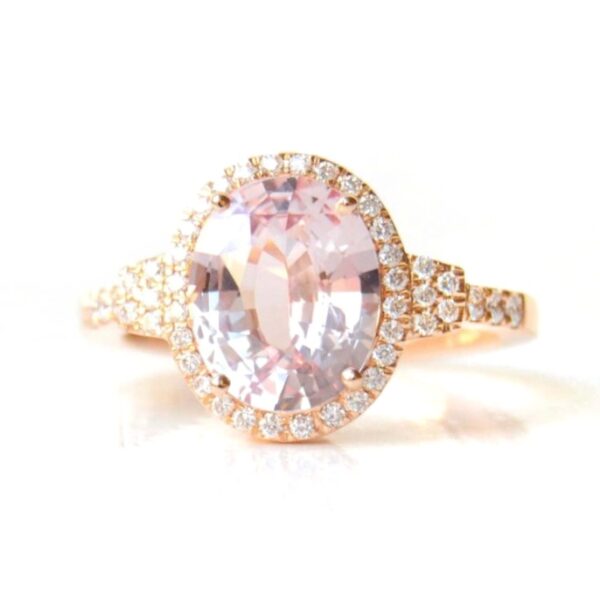 Peach sapphire halo ring with diamonds