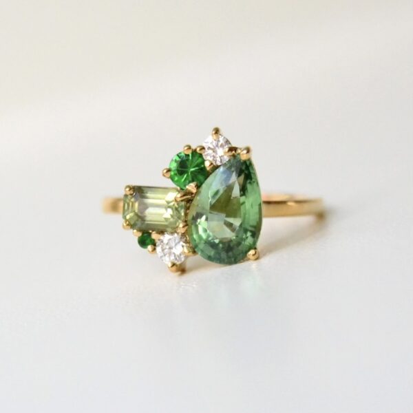 Green tourmaline cluster ring wit diamonds, sapphire and tsavorites