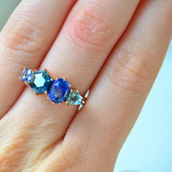 Cluster ring with blue and teal sapphires