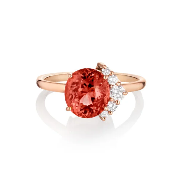 Orange tourmaline ring with half halo of diamonds set in rose gold