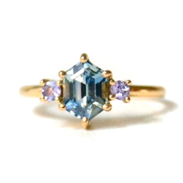 Teal sapphire ring with tanzanites