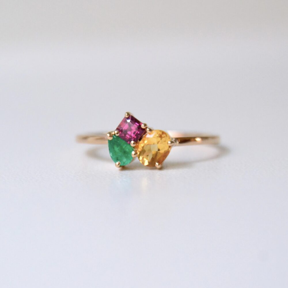 Birthstone ring with citrine, ruby and emerald set in 18K rose gold.