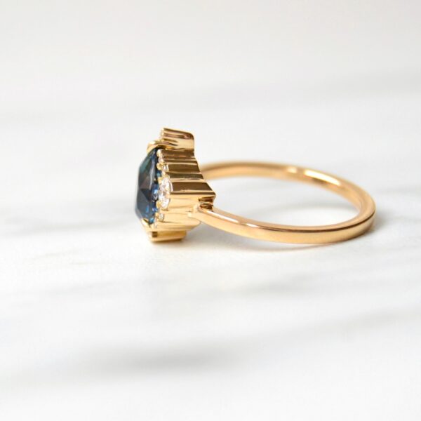 Asymmetric teal sapphire ring