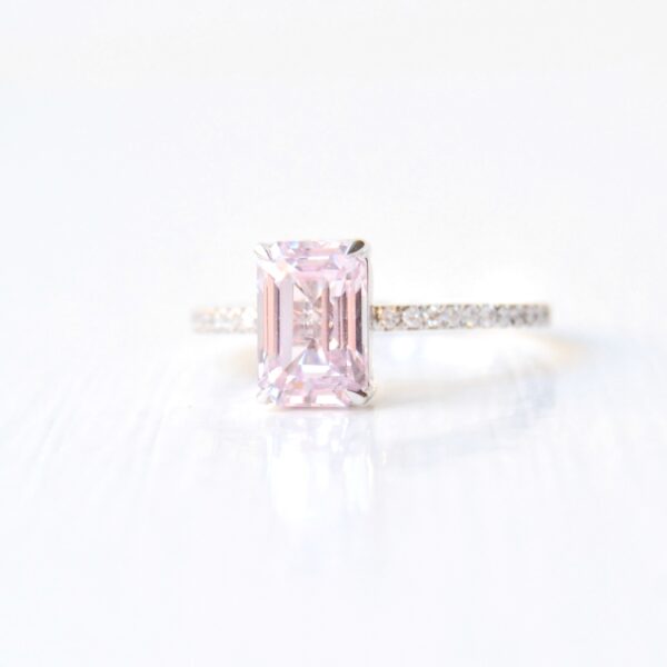 Baby pink sapphire ring with diamonds set in 18K white gold.