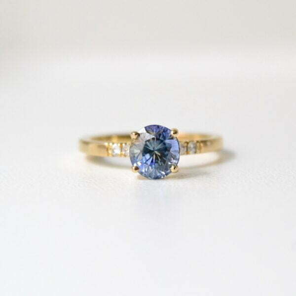 Bi-color sapphire ring with diamonds set in 18K yellow gold