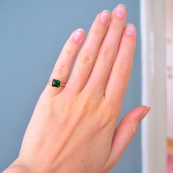 Green tourmaline solitaire ring with diamonds