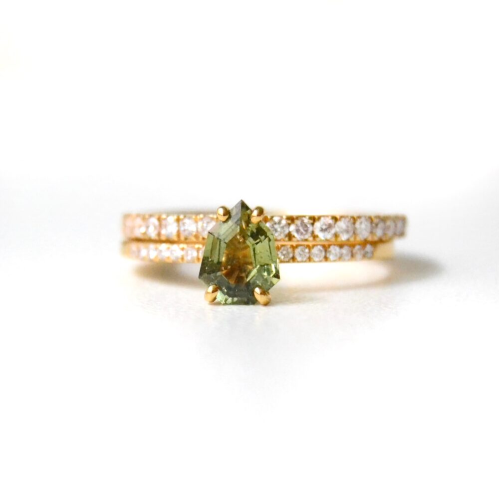 Green sapphire ring stack with loads of diamonds set in yellow gold