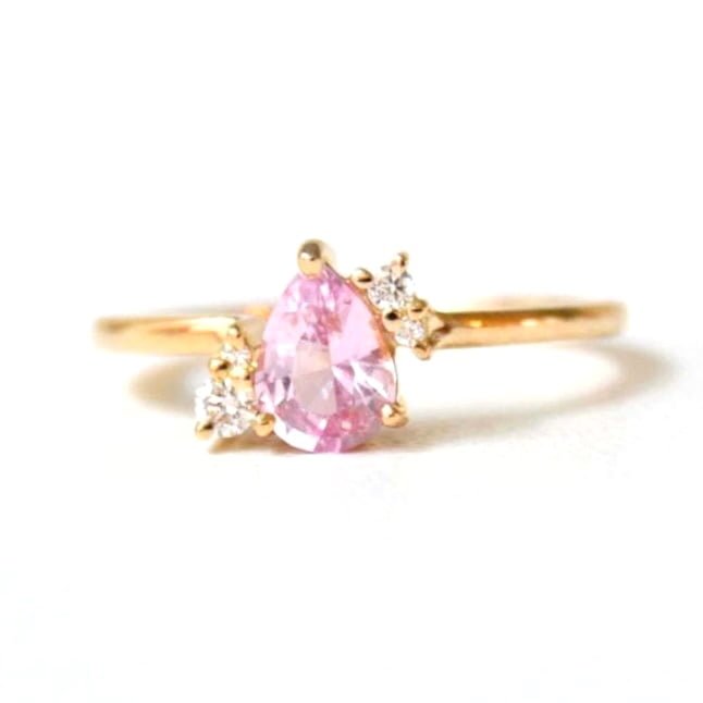 pink sapphire ring with diamonds set in 18k yellow gold