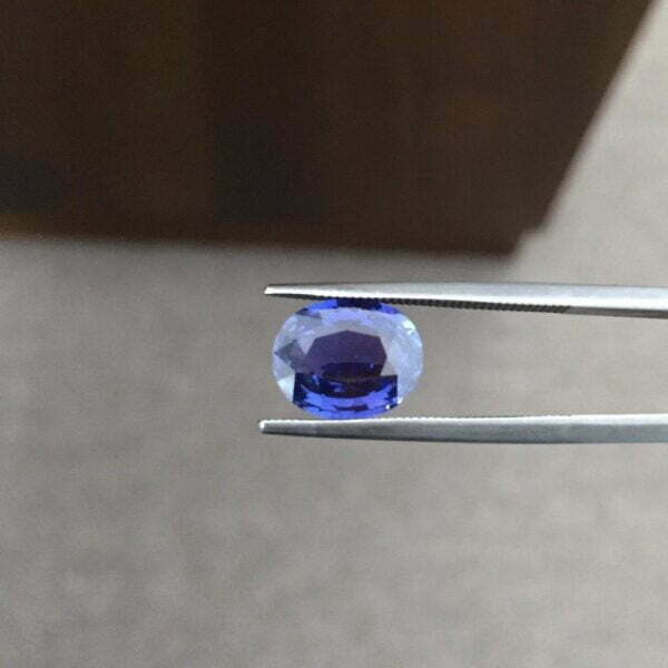 Color changing sapphire ring in a halo design