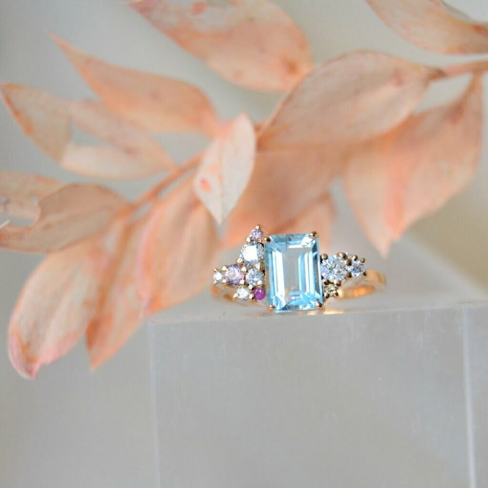Aquamarine cluster ring with diamonds and sapphires set in 18K rose gold