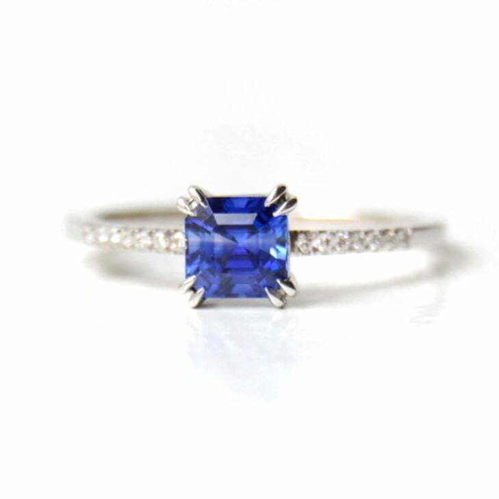 asscher cut blue sapphire ring with diamonds set in 18k white gold