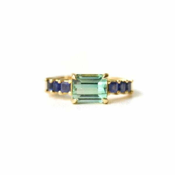 East west set tourmaline ring with sapphires in 18K yellow gold