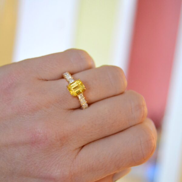 Emerald cut yellow sapphire ring with diamonds