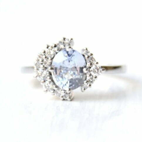 baby blue sapphire ringw ith diamonds set in 18k white gold