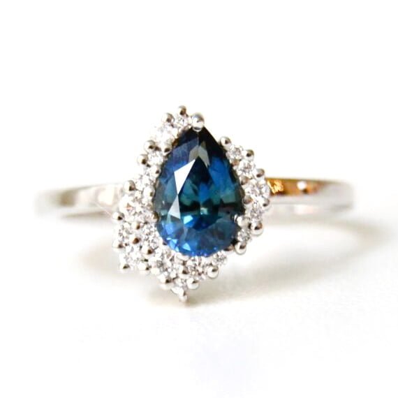 blue sapphire ring with diamonds set in 18k white gold