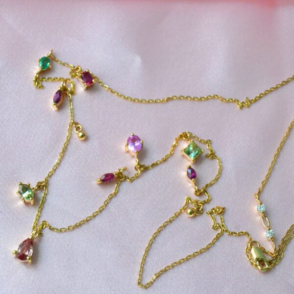 Heirloom necklace with a mix of sapphire, emerald, ruby and diamond