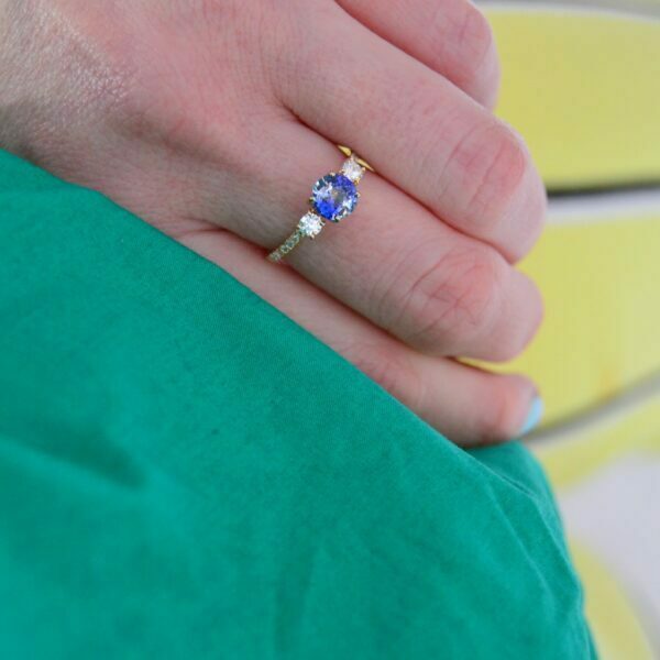 Bi-color sapphire three stone ring with diamonds