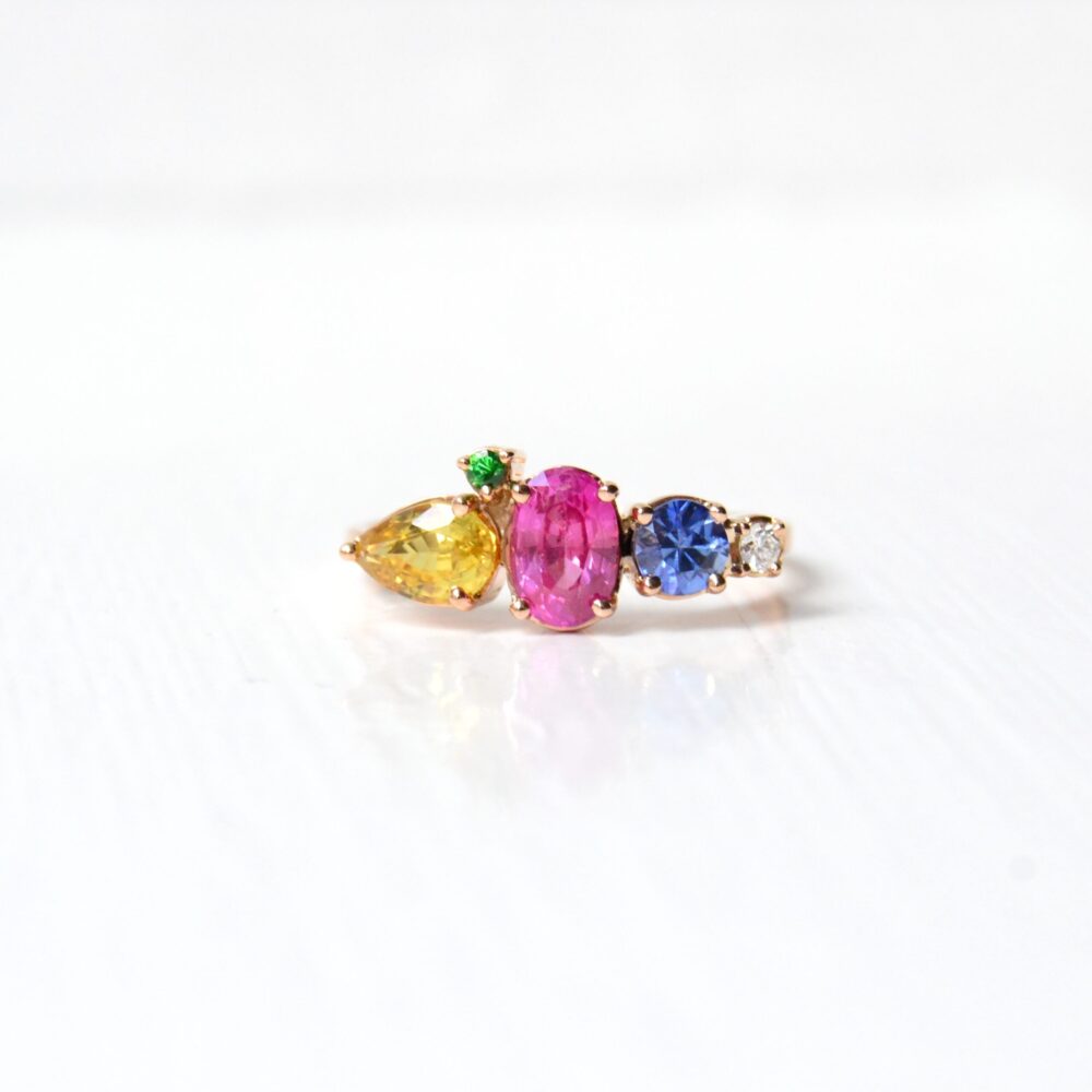 Cluster ring with saturated sapphires set in 18K rose gold.