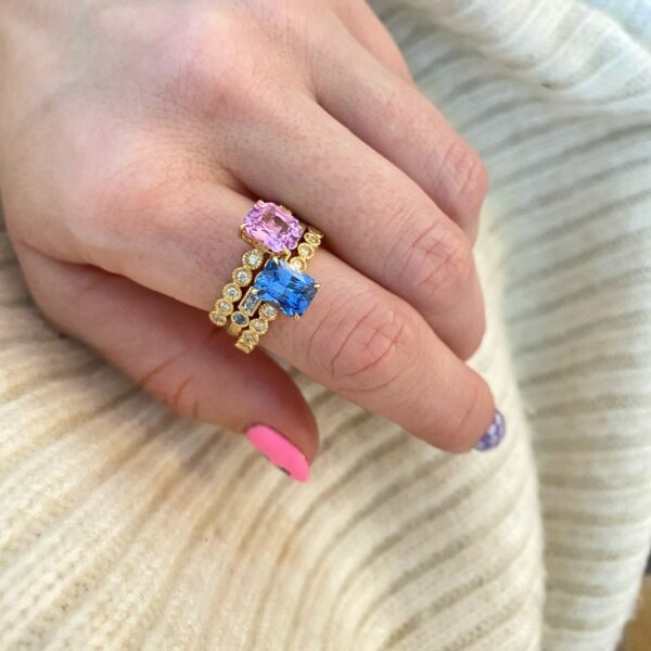 Pink and blue sapphire ring stack with diamonds