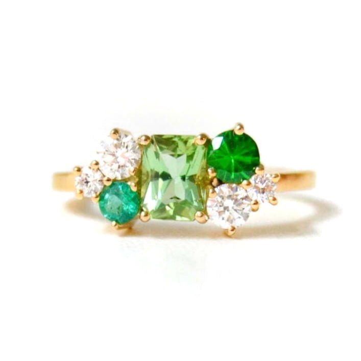 green tourmaline ring with tsavorites, emeralds and diamonds