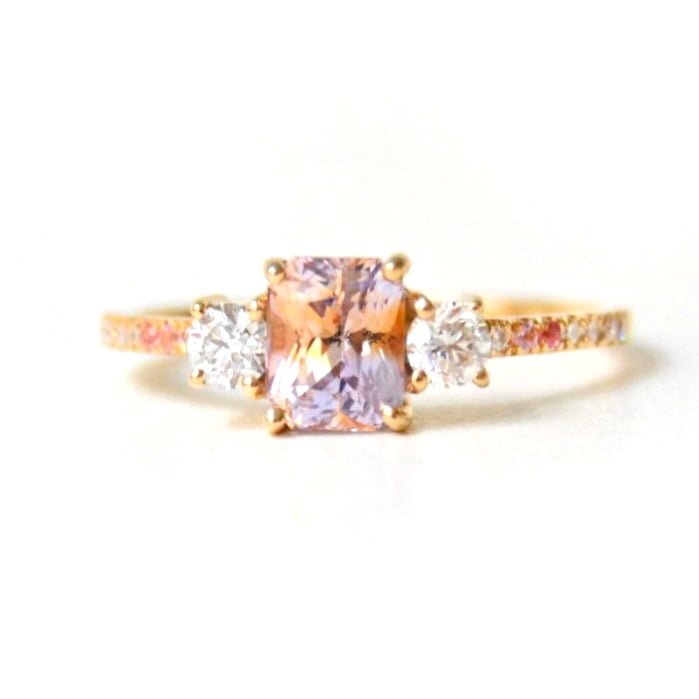 radiant cut sapphire set with diamonds in 18k yellow gold