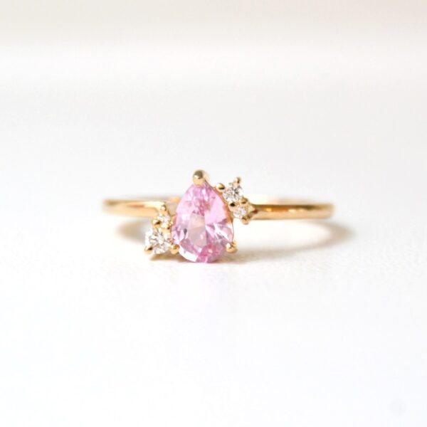 Pear shaped pink sapphire ring with diamonds