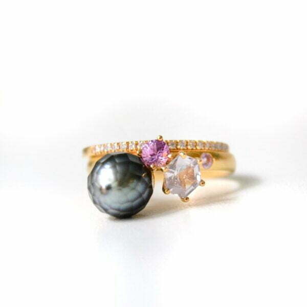 Jalaya pearl ring stacked with diamond half eternity ring set in yellow gold.