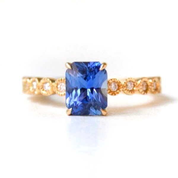 blue sapphire ring with diamonds set in 18k yellow gold