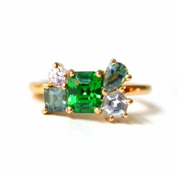 Tsavorite ring With sapphires set in 18k yellow gold