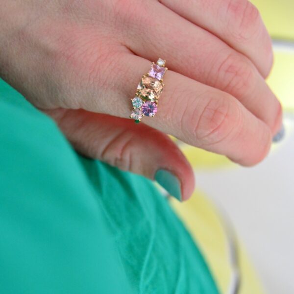 Peach tourmaline cluster ring with sapphires