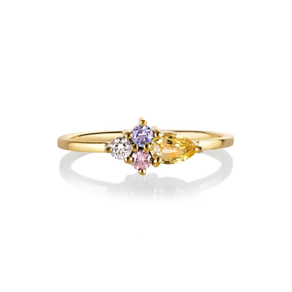 Cluster ring with pastel sapphire set in 18K yellow gold.