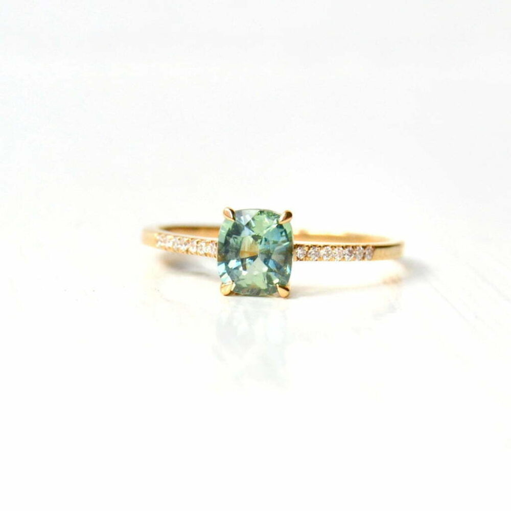cushion cut green sapphire ring with diamonds set in 18K yellow gold