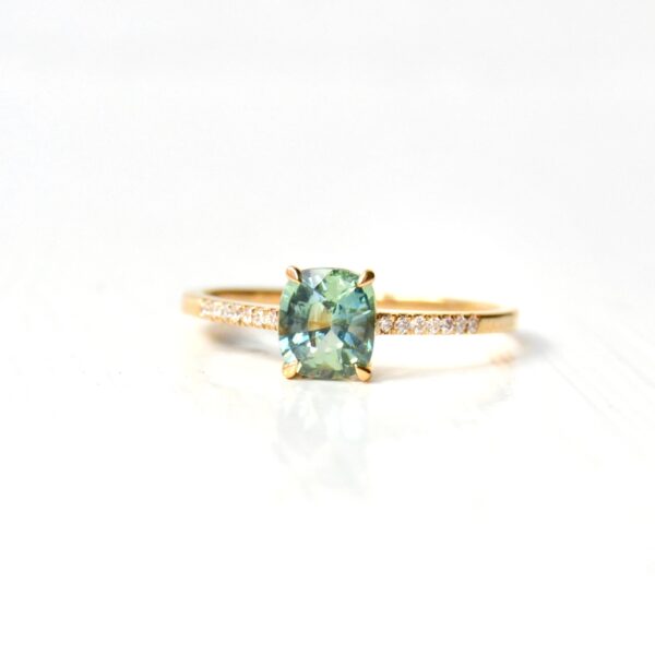 cushion cut green sapphire ring with diamonds set in 18K yellow gold