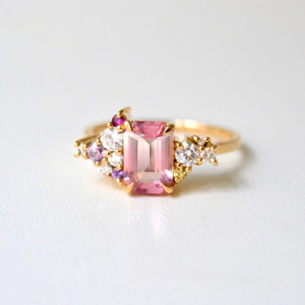 Unheated bi-color tourmaline ring with diamonds and sapphires set in 18K yellow gold