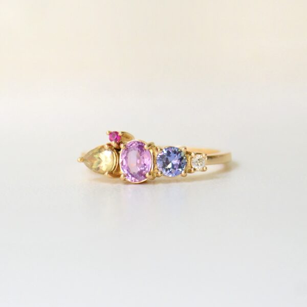 cluster ring with pastel sapphires set in 18k yellow gold