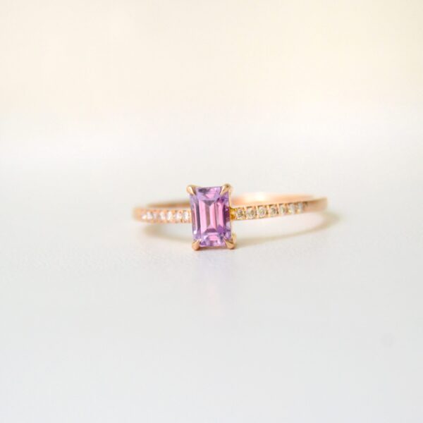 Pink sapphire ring with diamonds set in 18K yellow gold.