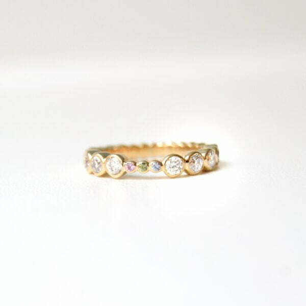 Full eternity ring with diamonds and sapphires set in 18K yellow gold