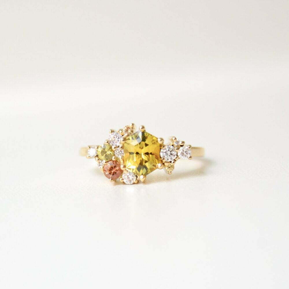 sapphire cluster ring with diamonds set in 18K yellow gold